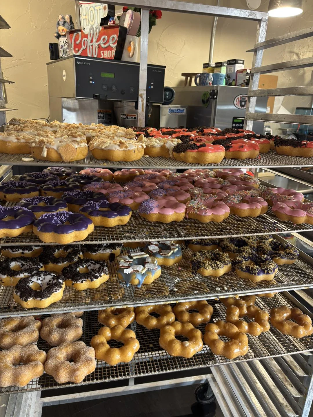 Vertical rack of colorful donuts