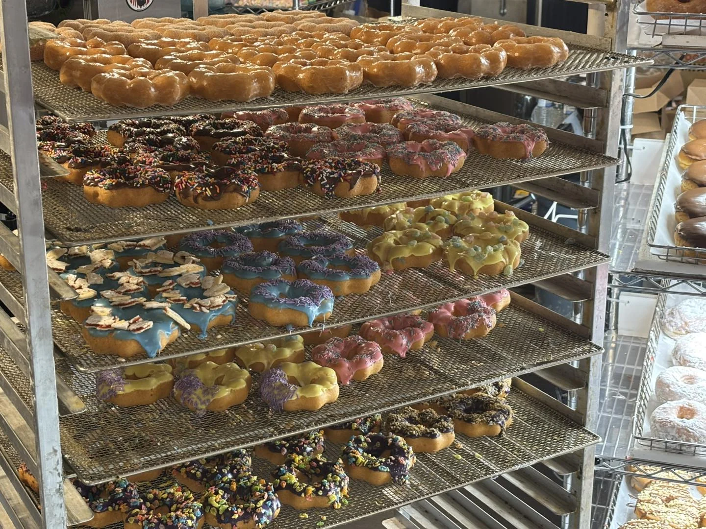 Racks of colorful donuts