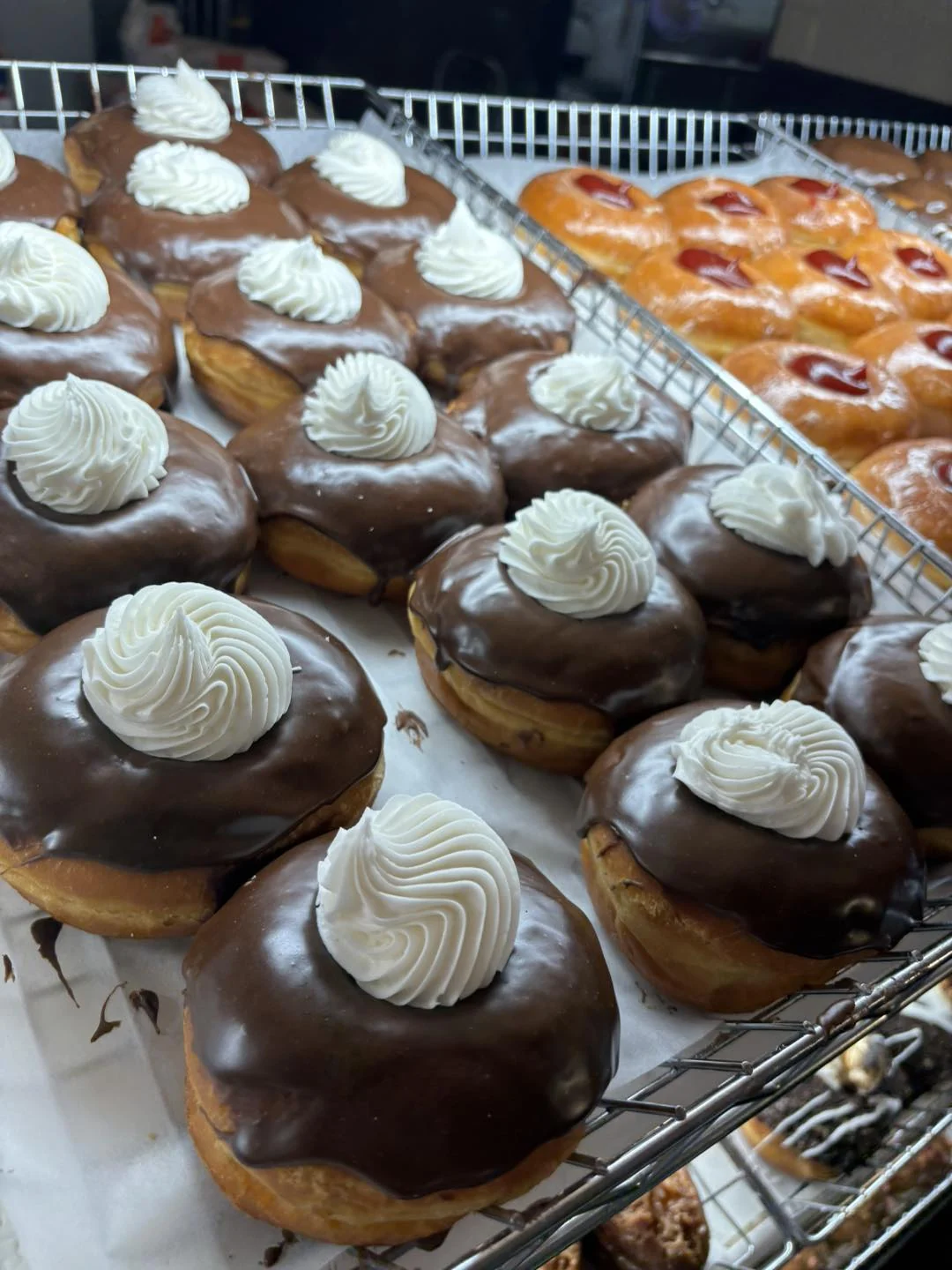 Chocolate donuts topped with cream